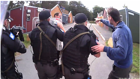 A patrol of four police officers arriving at the scene of a stabbing